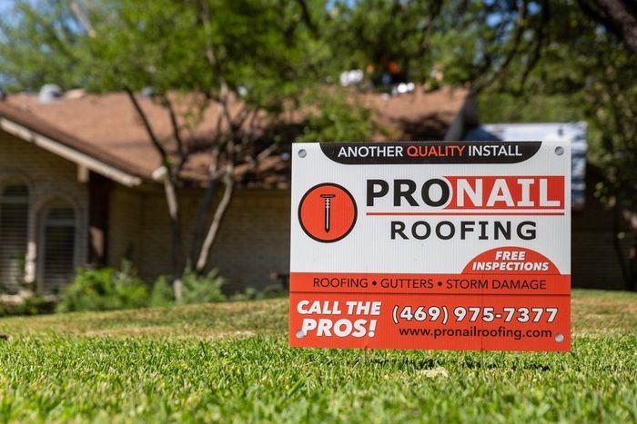 Pronail roofing sign on the lawn